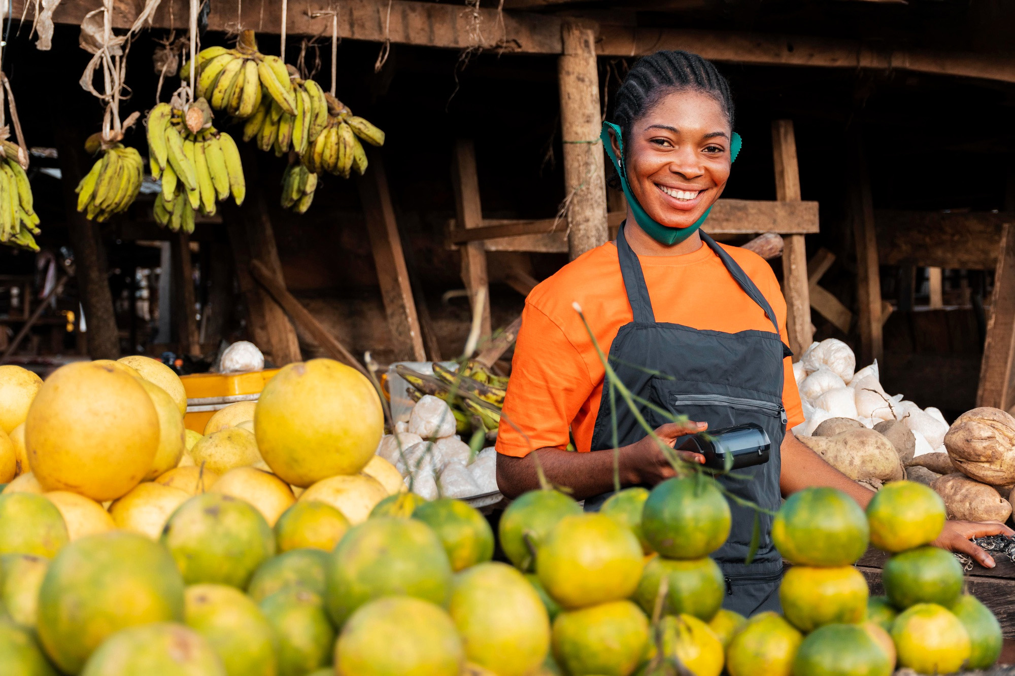 Ghanaian market woman selling colorful goods